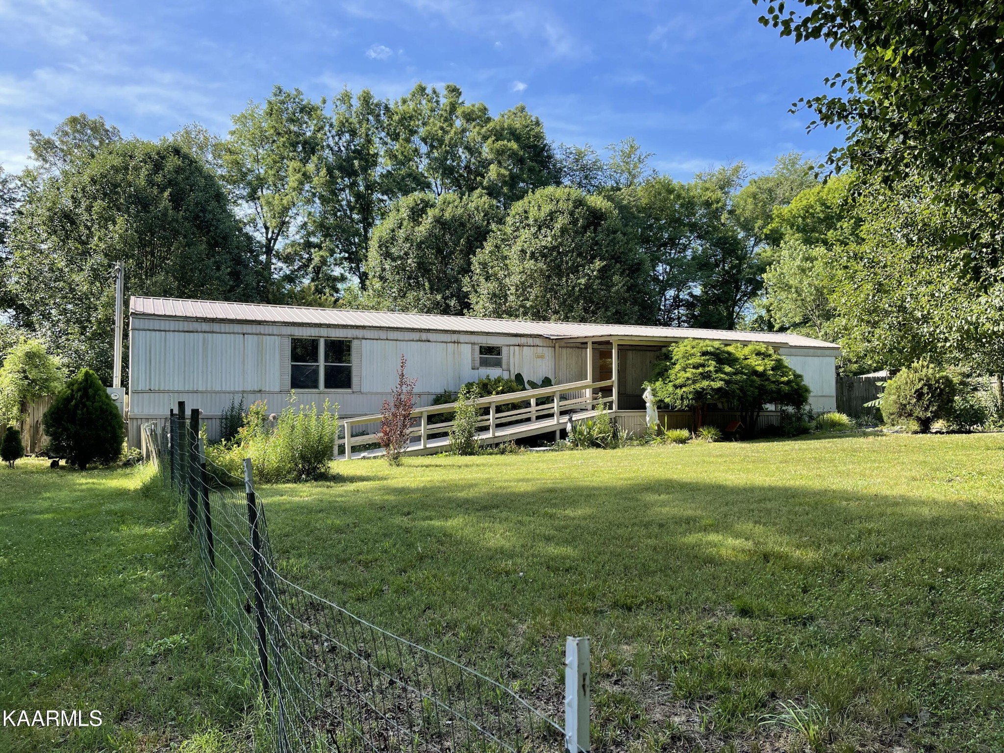 625 Miller Road Bybee, TN 37713 - Photo 34 of 34 a backyard of a house with table and chairs