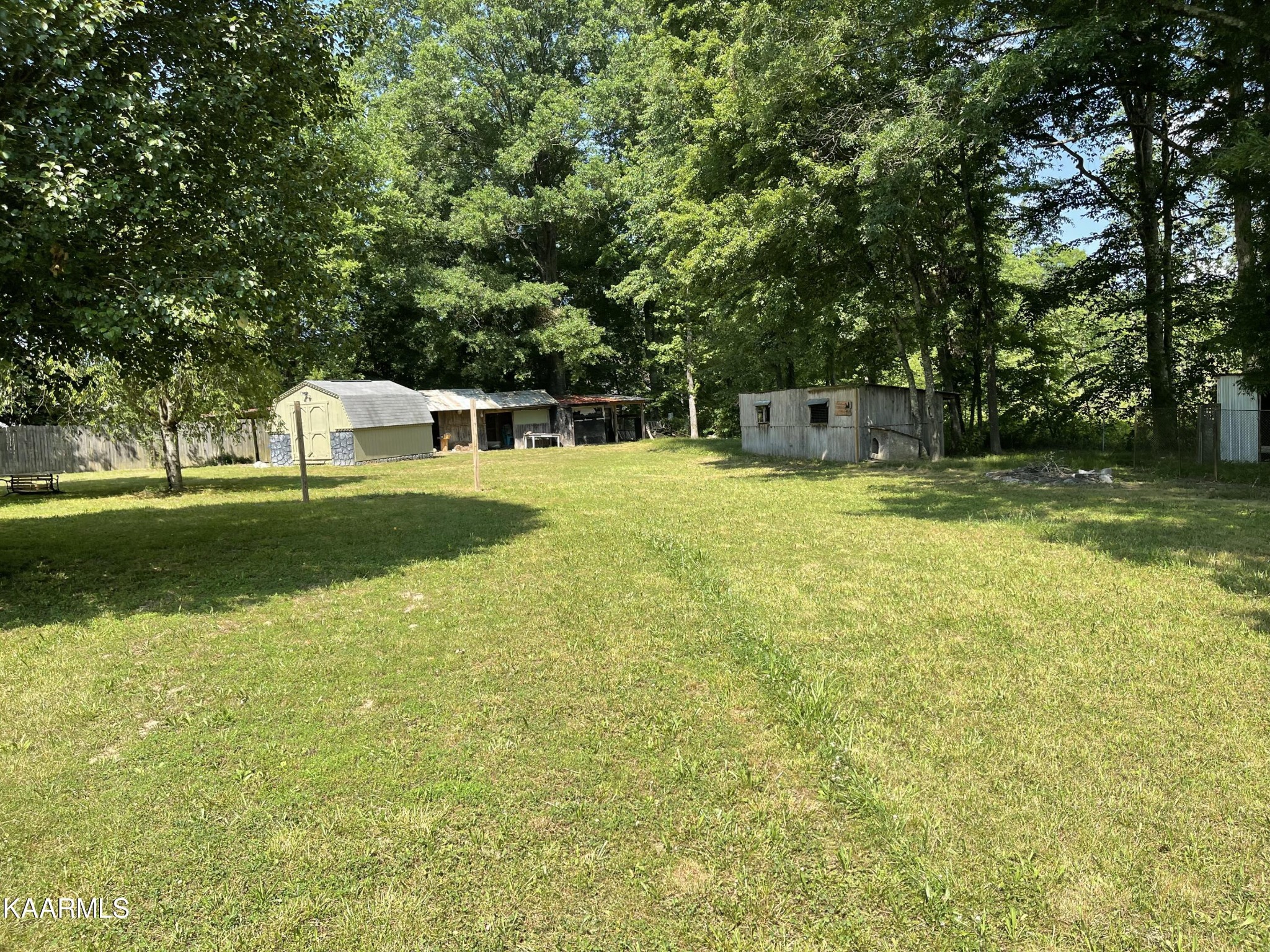 625 Miller Road Bybee, TN 37713 - Photo 5 of 34 a view of a swimming pool with a yard