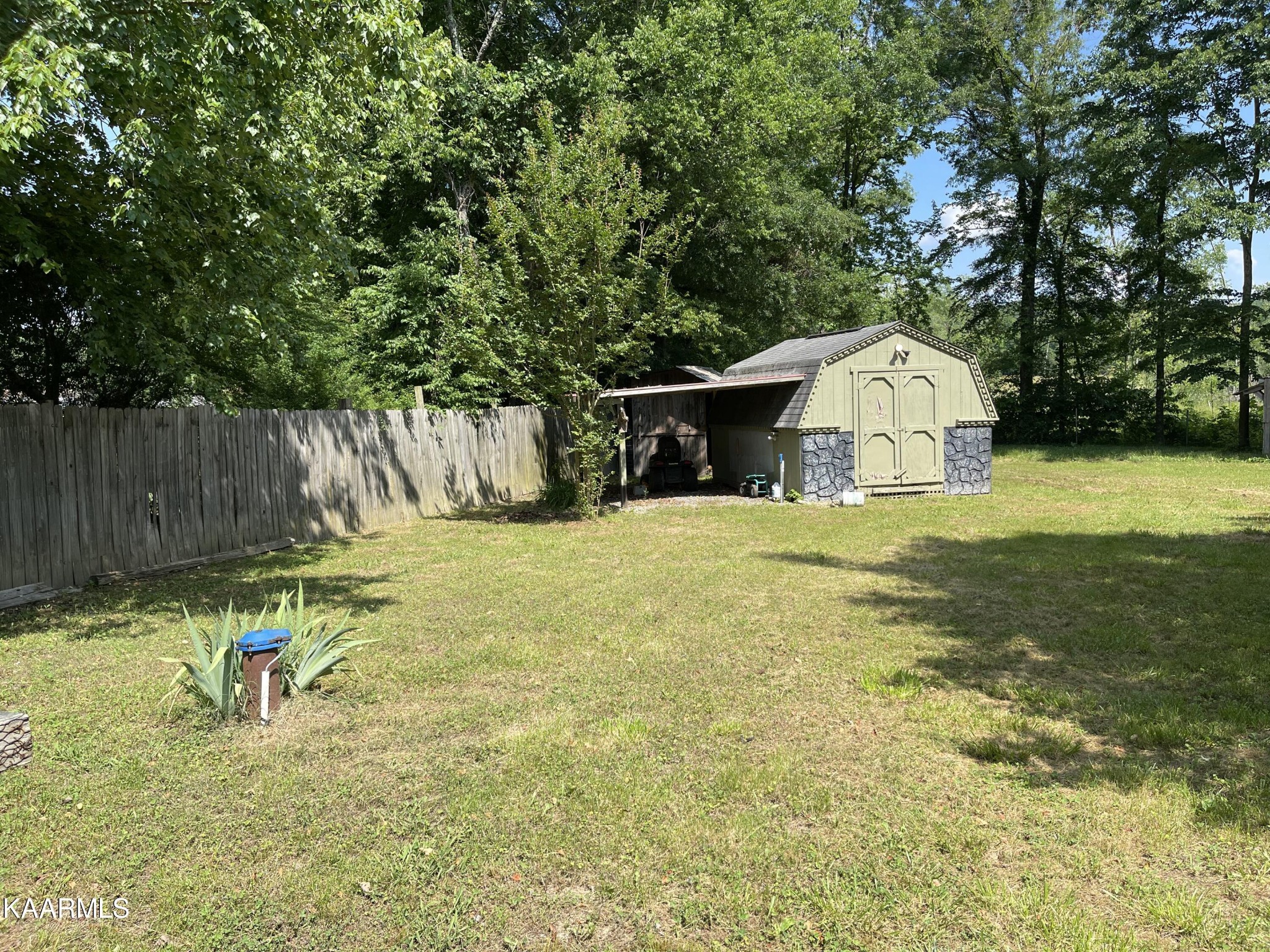 625 Miller Road Bybee, TN 37713 - Photo 6 of 34 a view of a backyard with a small cabin