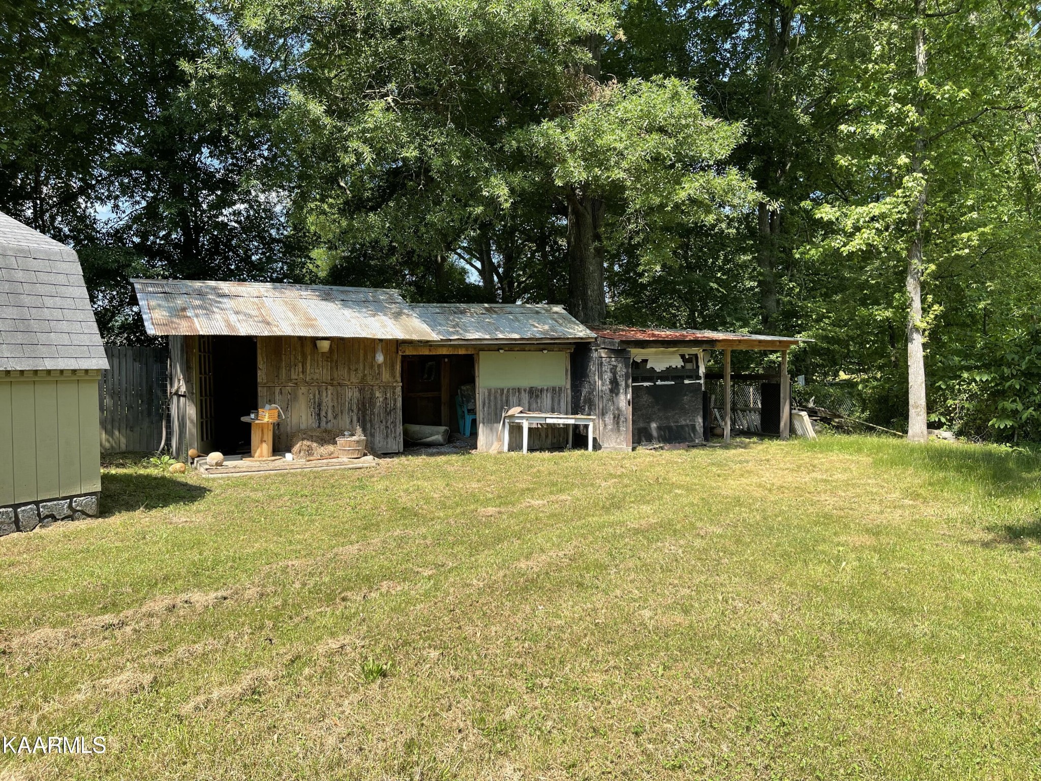625 Miller Road Bybee, TN 37713 - Photo 8 of 34 a front view of a house with a garden and porch