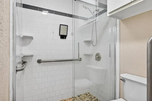 a bathroom with a sink double vanity and a shower
