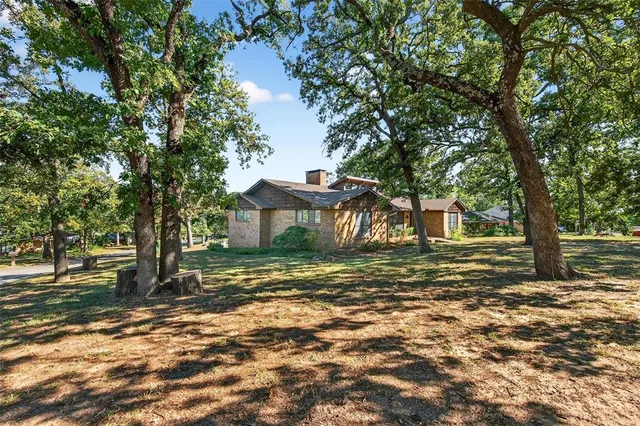 a view of a trees in front of a house