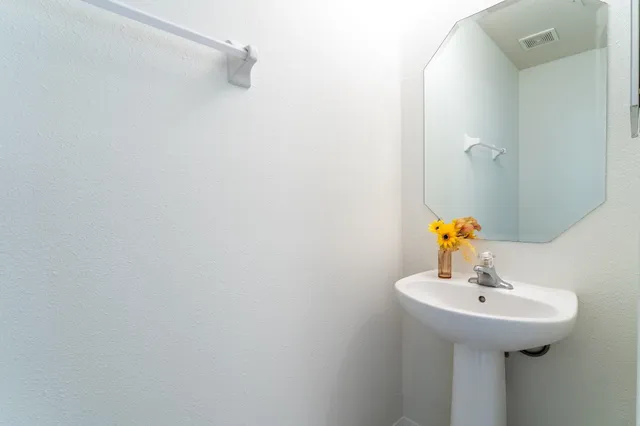 a view of a kitchen with a sink and a window