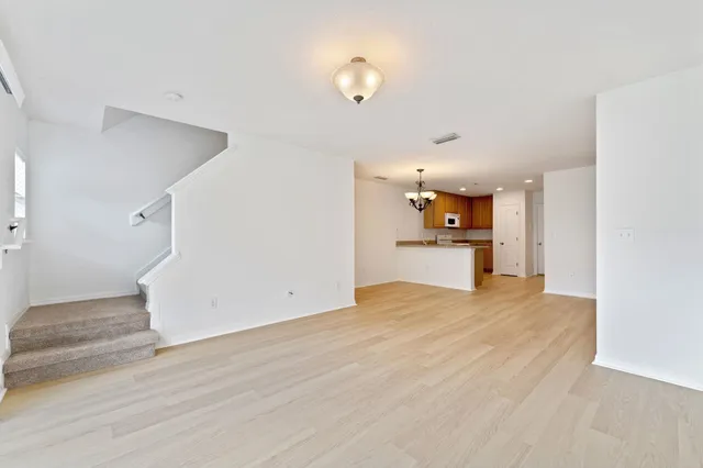 a view of backyard of house with green space