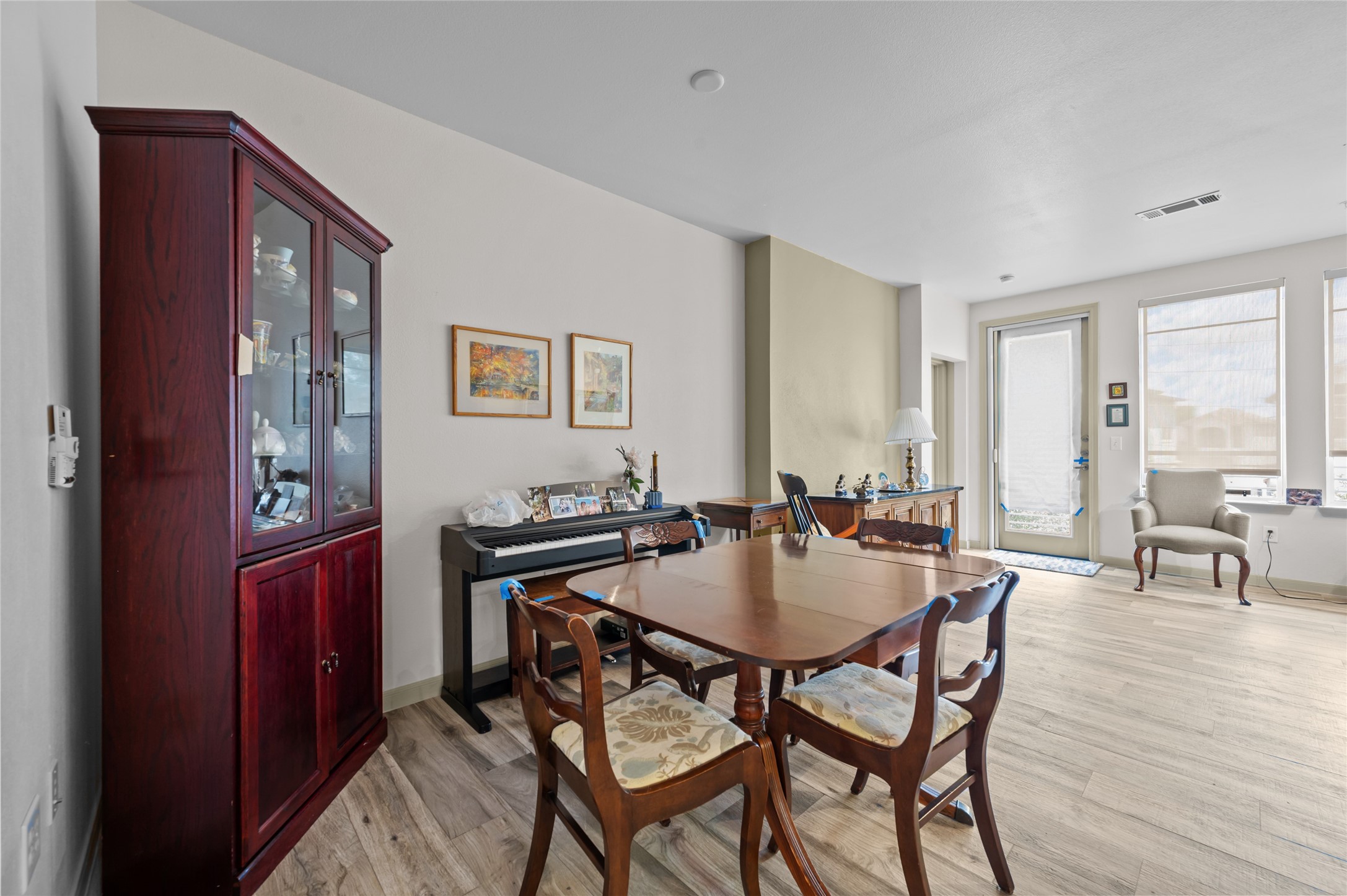 505 Jackson Hill Street, Unit 206 Houston, TX 77007 - Photo 11 of 35 a view of a dining room with furniture and wooden floor