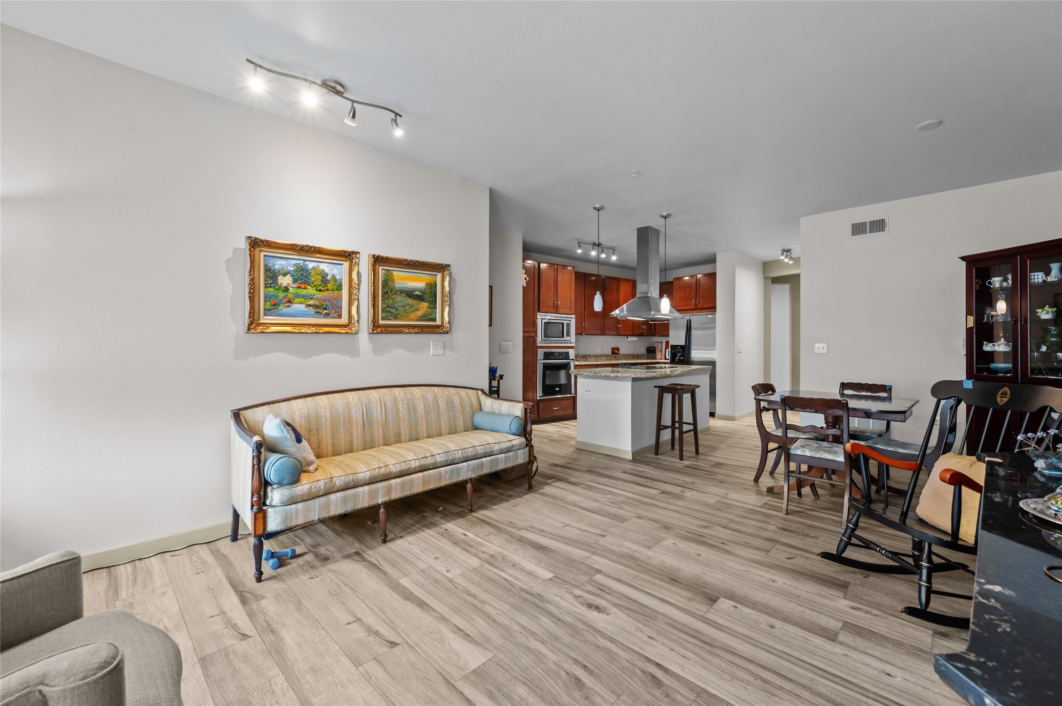 505 Jackson Hill Street, Unit 206 Houston, TX 77007 - Photo 14 of 35 a living room with furniture and a wooden floor