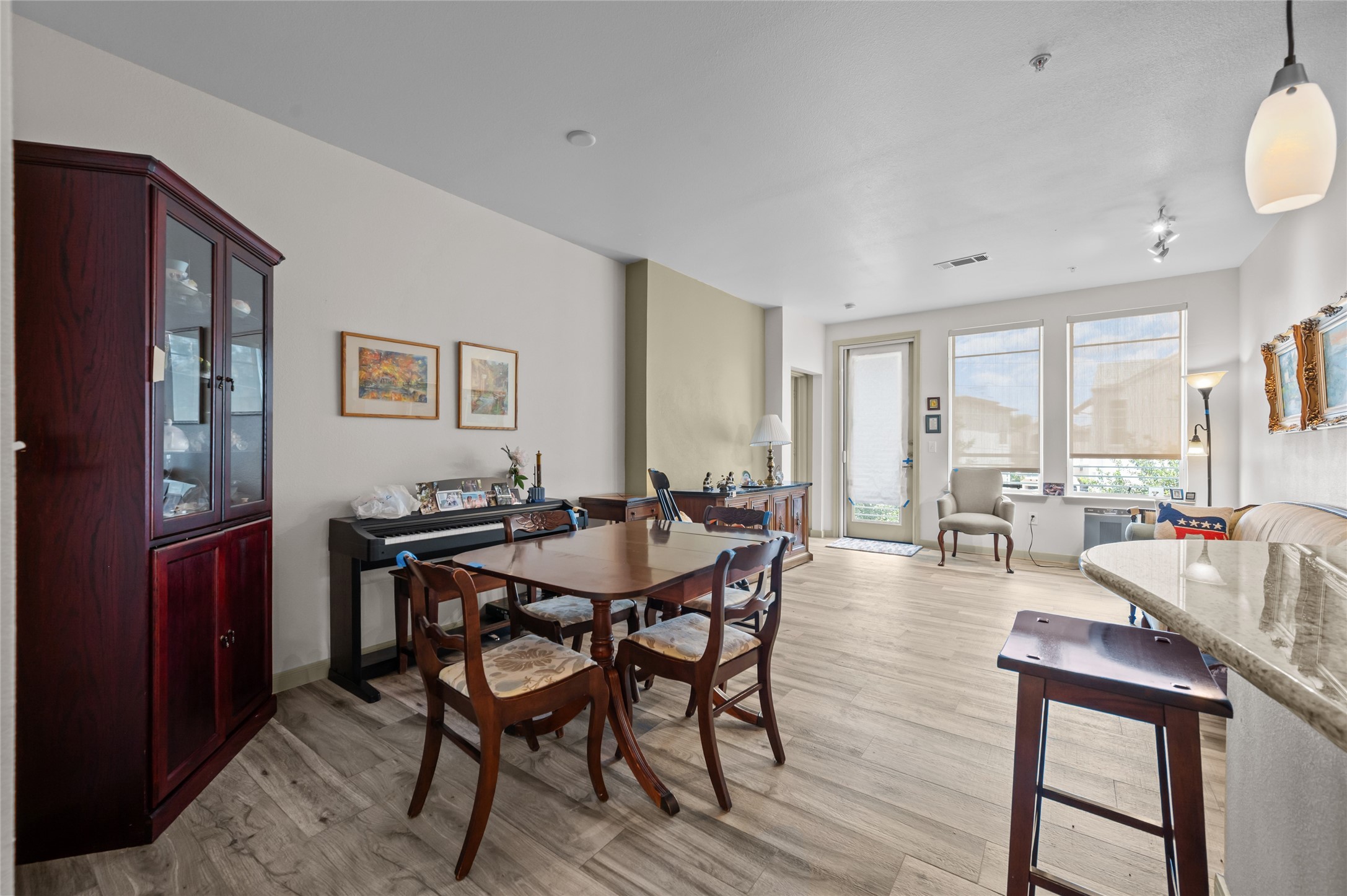 505 Jackson Hill Street, Unit 206 Houston, TX 77007 - Photo 27 of 35 a view of a dining room with furniture and a large window