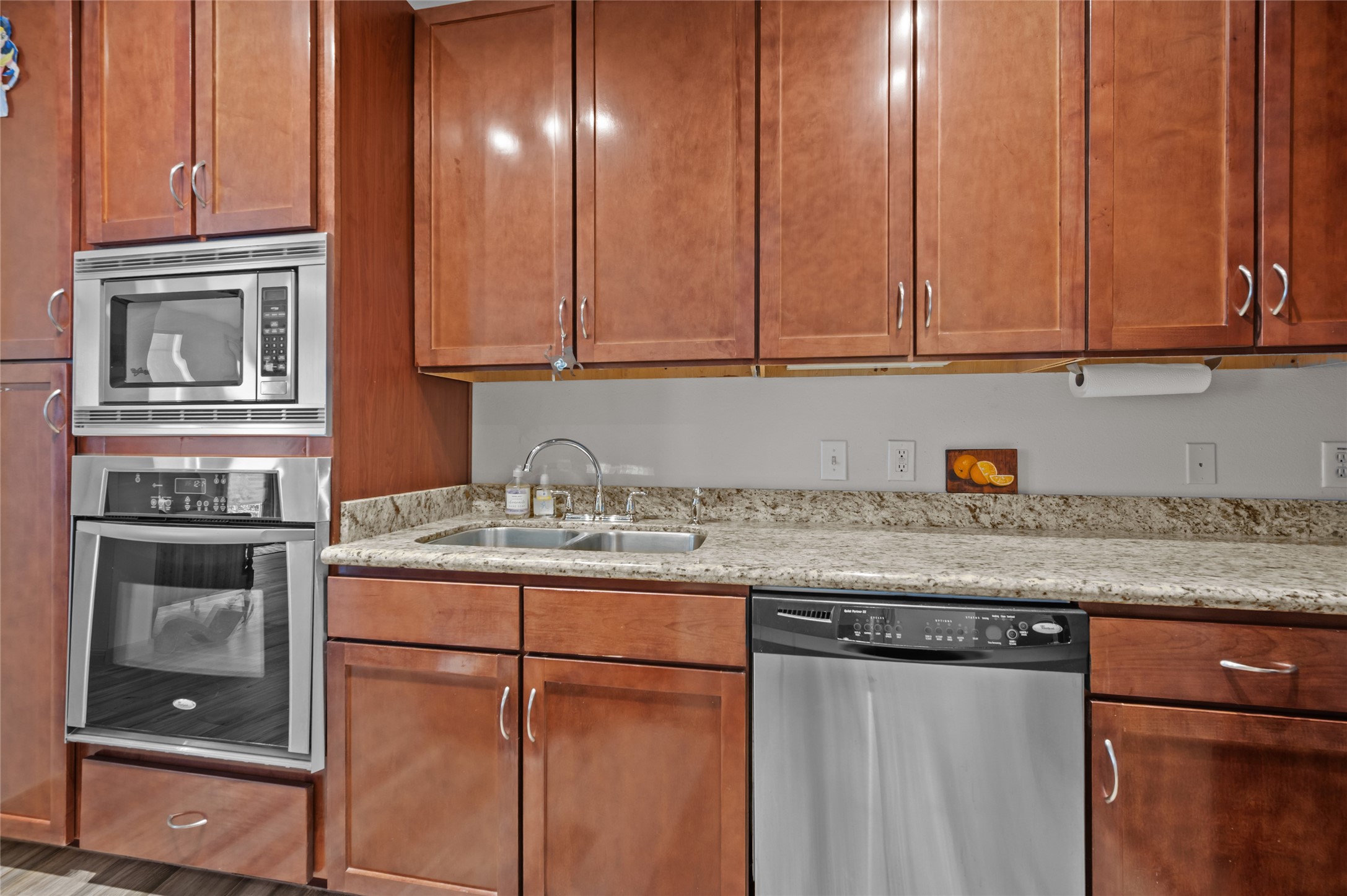 505 Jackson Hill Street, Unit 206 Houston, TX 77007 - Photo 7 of 35 a kitchen with granite countertop cabinets stainless steel appliances and a counter top space