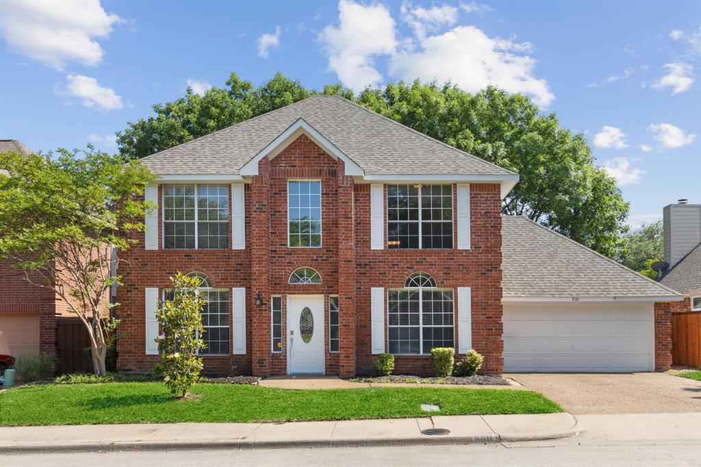 5011 Falcon Hollow Road McKinney, TX 75072 - Photo 1 of 1 a front view of a house with a yard and garage
