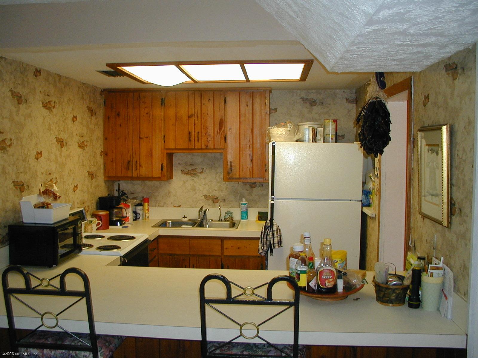 5343 Stetson Road Jacksonville, FL 32207 - Photo 5 of 8 a kitchen with a sink and cabinets