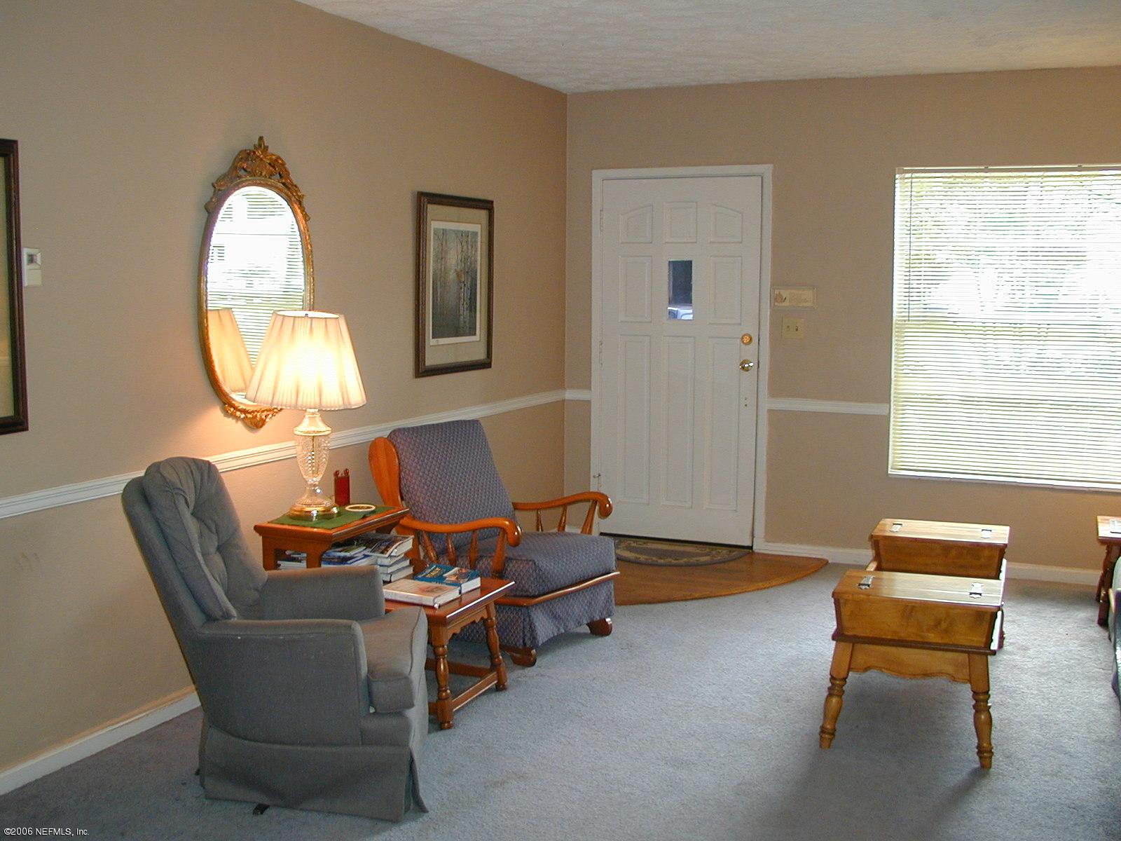 5343 Stetson Road Jacksonville, FL 32207 - Photo 8 of 8 a living room with furniture and a mirror
