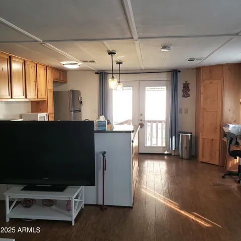 a kitchen with counter top space and windows