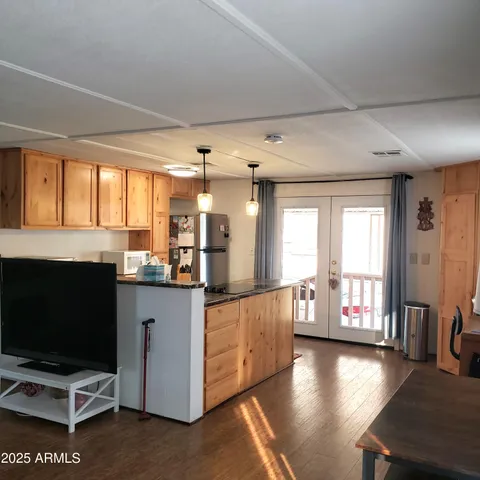 a kitchen with stainless steel appliances granite countertop a stove and a refrigerator