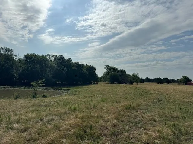 a view of outdoor space with deck and yard