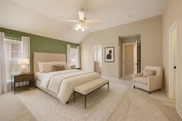 a spacious bedroom with a bed and a chandelier