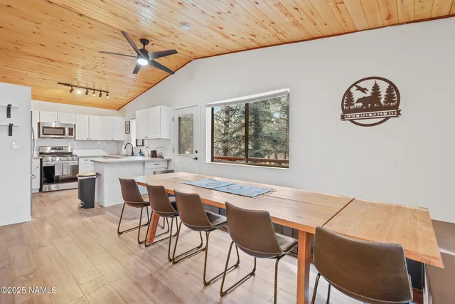 a dining room with furniture and window
