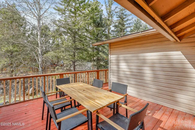 a view of a patio with wooden floor