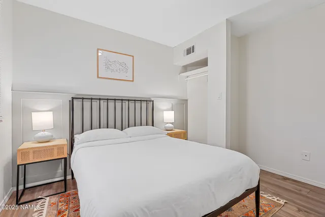 a bedroom with a bed and a chair