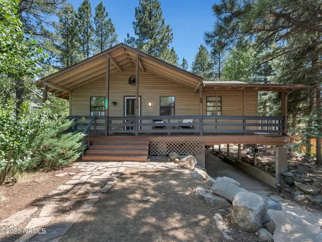 a view of a patio with two chairs and a table