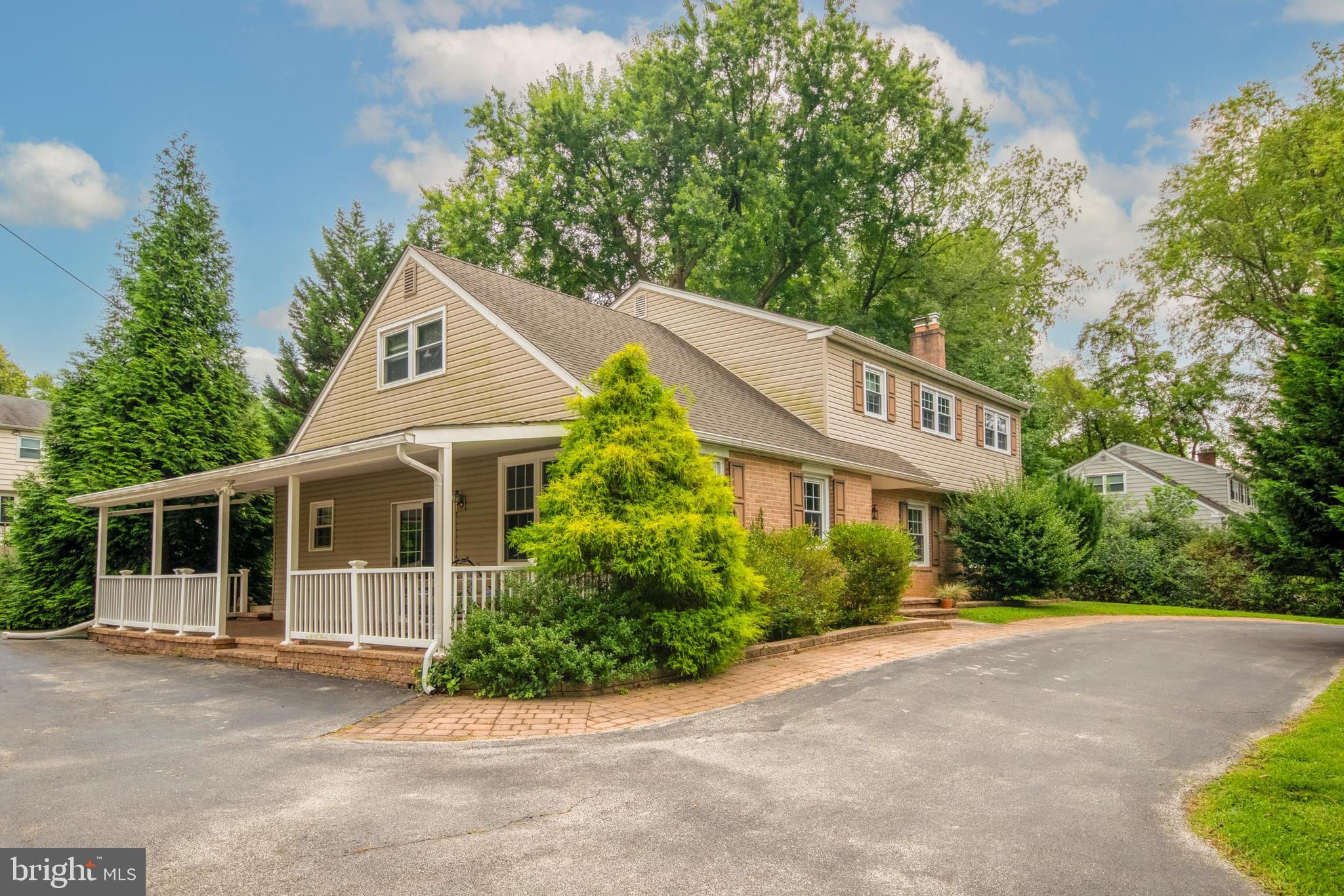 a house with a tree in front of it