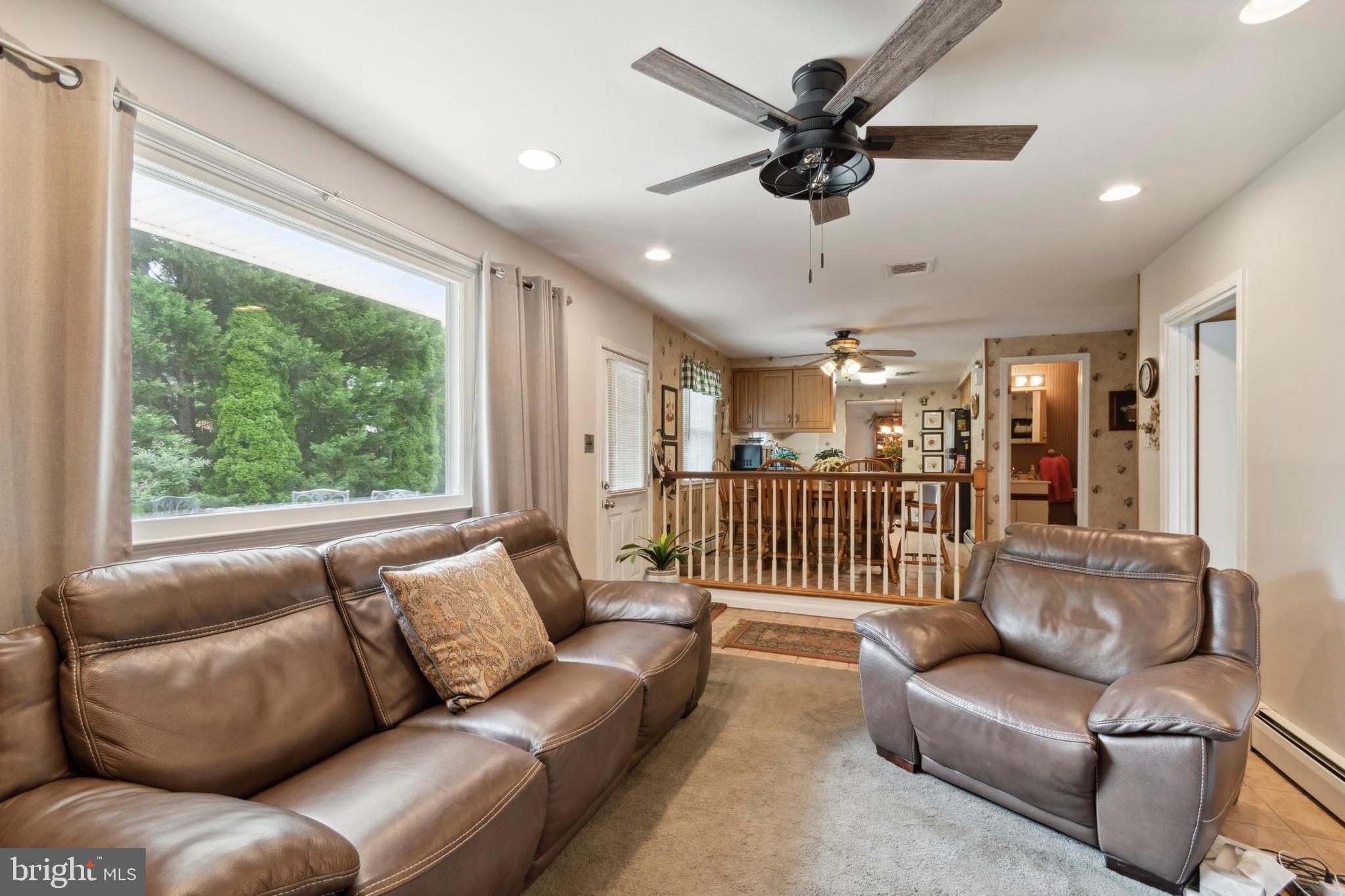 610 Brookhaven Road Wallingford, PA 19086 - Photo 12 of 25 a living room with furniture and a large window