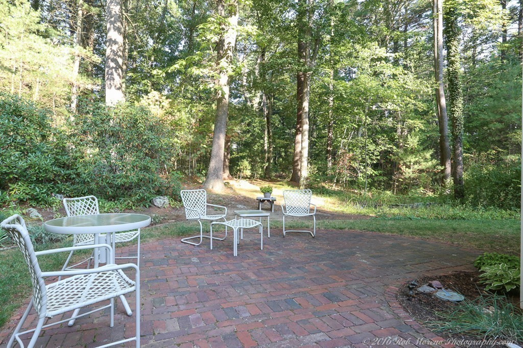 18 High Ridge Road Boxford, MA 01921 - Photo 25 of 30 a view of a chairs and table in backyard