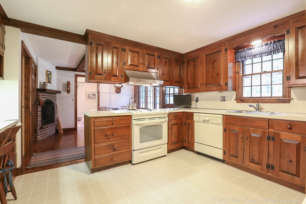 18 High Ridge Road Boxford, MA 01921 - Photo 3 of 30 a kitchen with cabinets wooden floor and stainless steel appliances