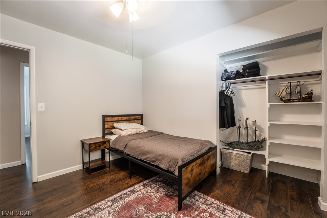 1324 Appaloosa Road Boulder City, NV 89005 - Photo 25 of 42 Rich hardwood flooring and a functional closet system outfit this comfortable, inviting bedroom.