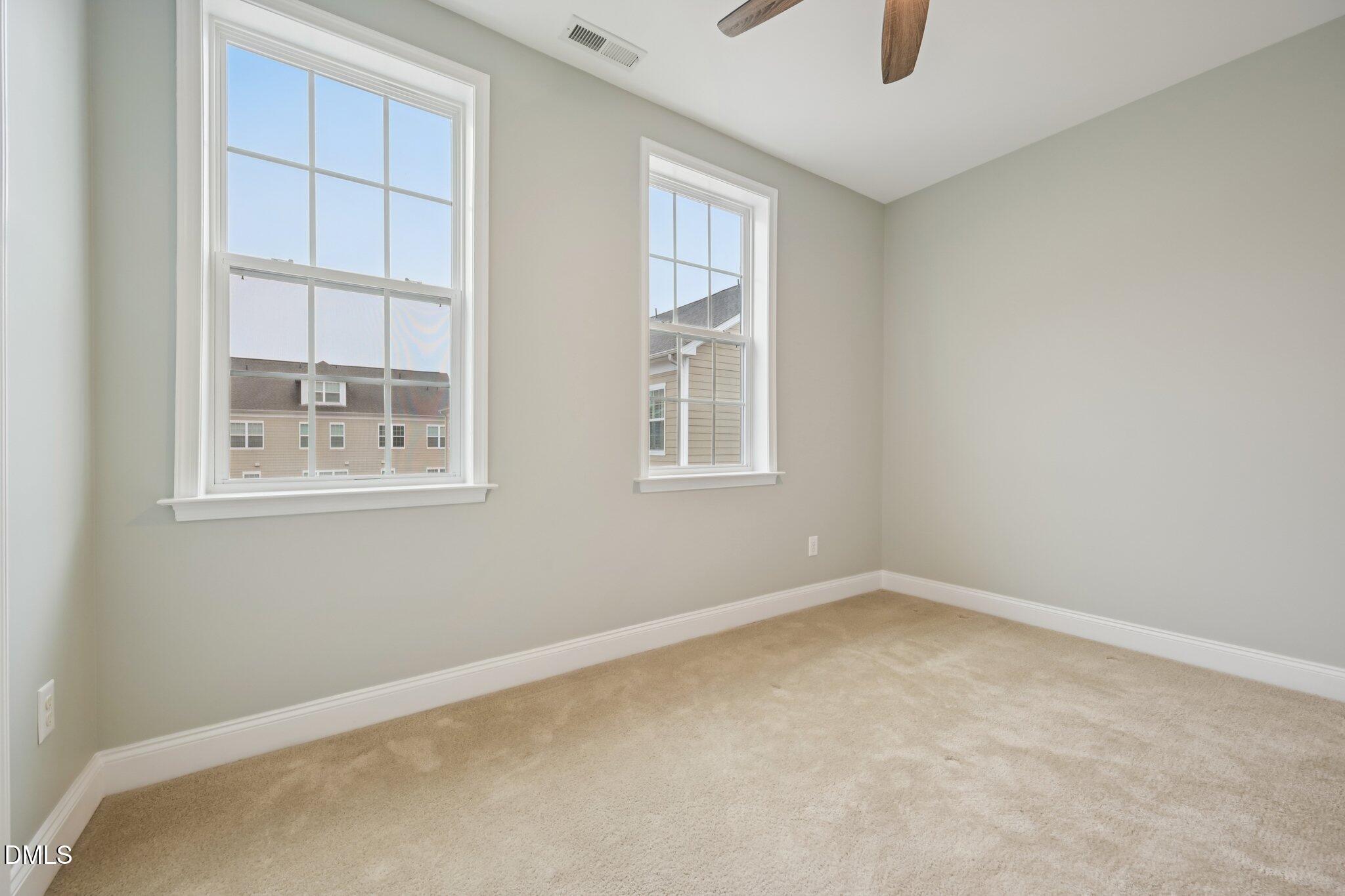 10510 Sablewood Drive, Unit 113 Raleigh, NC 27617 - Photo 32 of 38 an empty room with windows