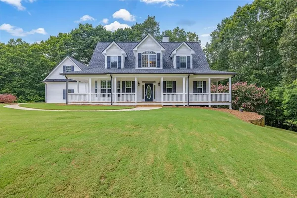 front view of a house with a yard