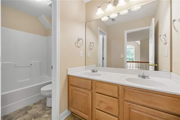 a view of a living room with wooden floor and balcony