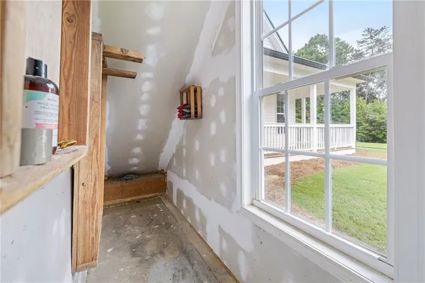 a front view of a house with a yard table and chairs