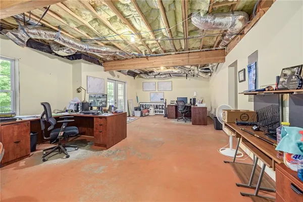 a front view of a house with a garden and trees