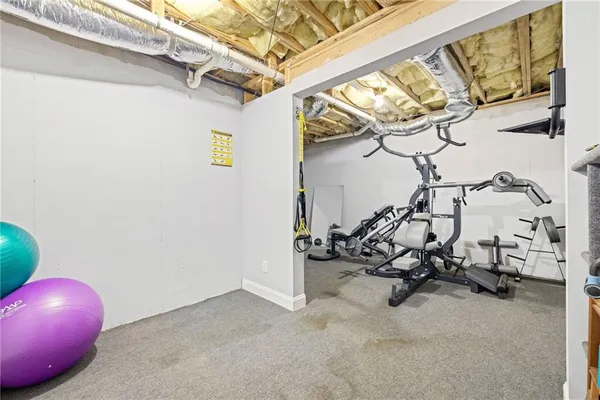 an aerial view of a house with a swimming pool and garden