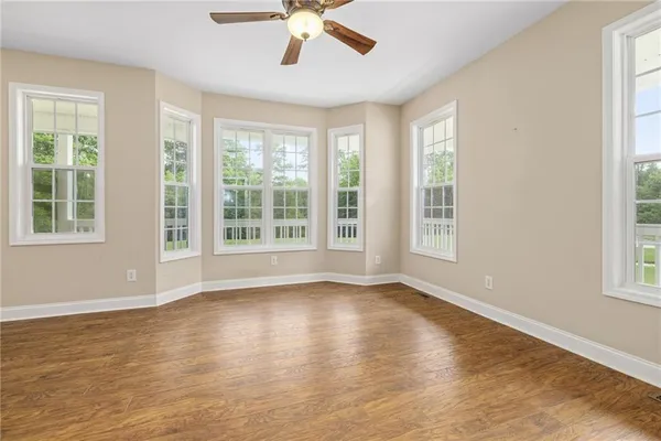 a large kitchen with kitchen island granite countertop a large window in it