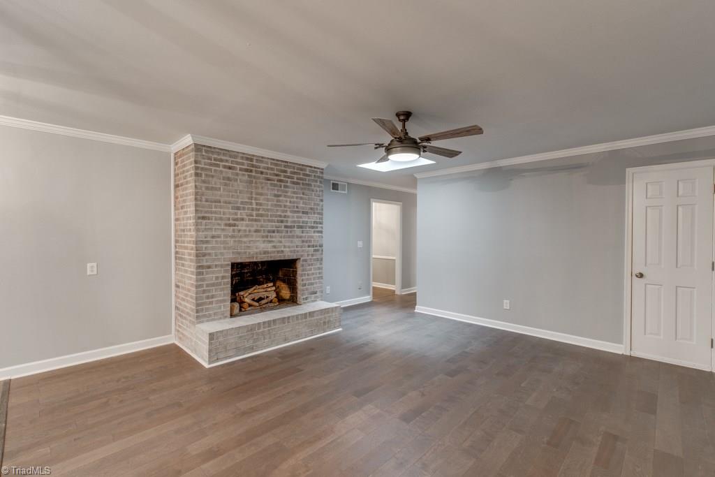 4180 Witherow Road Winston-Salem, NC 27106 - Photo 11 of 24 Den with Fireplace off the Kitchen with open concept