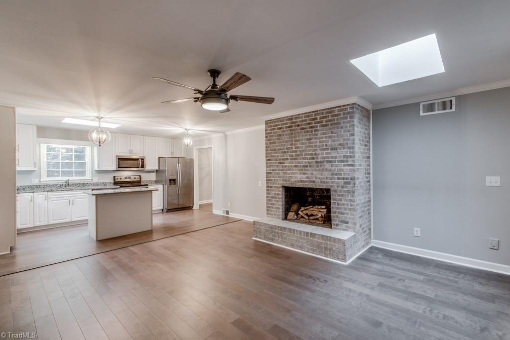 4180 Witherow Road Winston-Salem, NC 27106 - Photo 12 of 24 Beautiful Den with Fireplace open to kitchen