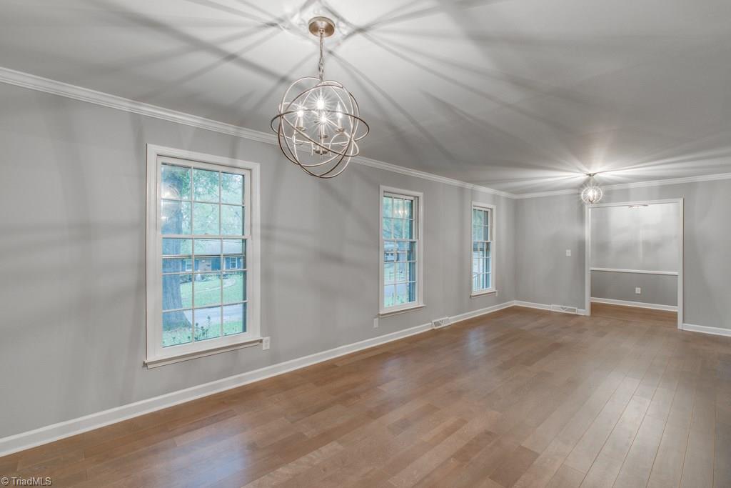 4180 Witherow Road Winston-Salem, NC 27106 - Photo 6 of 24 Dining Room and Living Room with Plenty of Space for entertaining