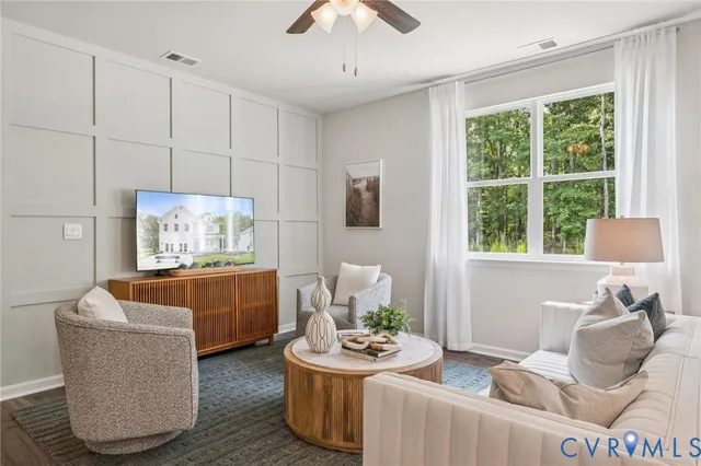 a living room with furniture and a window