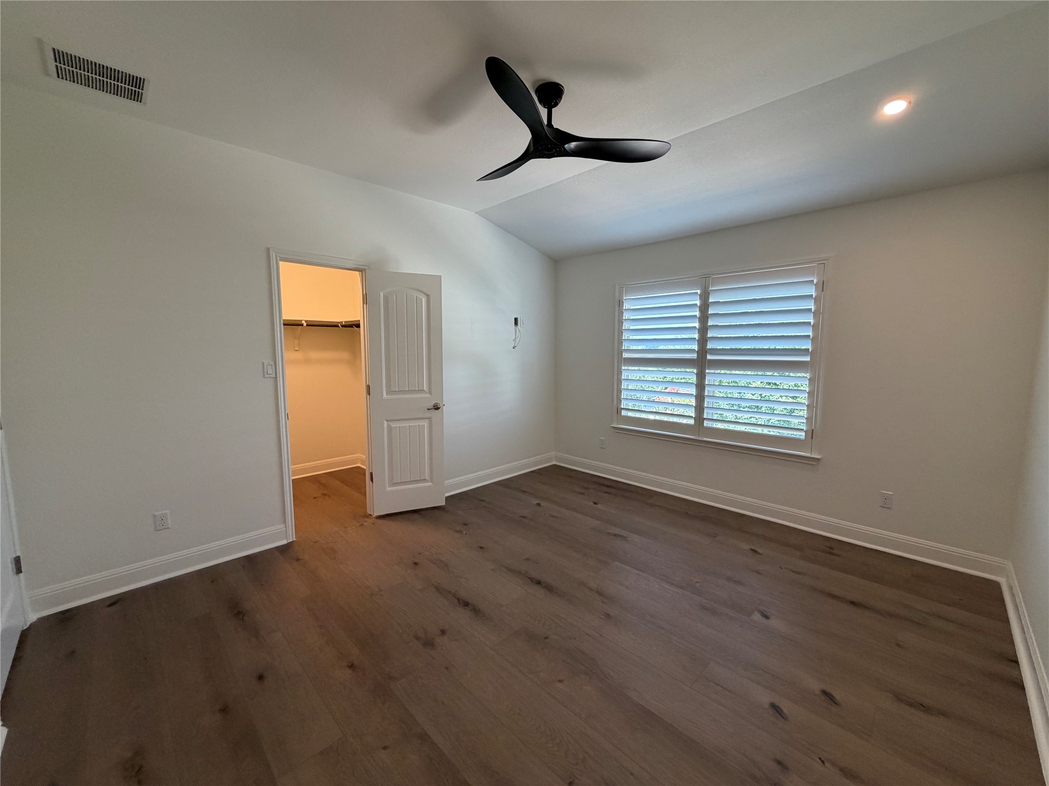 7801 Aria Loop Austin, TX 78736 - Photo 30 of 40 Secondary bedroom 2 overlooks the side yard and has a walk-in closet