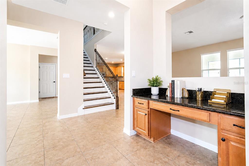 8531 Geddes Loop Orlando, FL 32836 - Photo 8 of 20 a kitchen with stainless steel appliances granite countertop a sink and cabinets