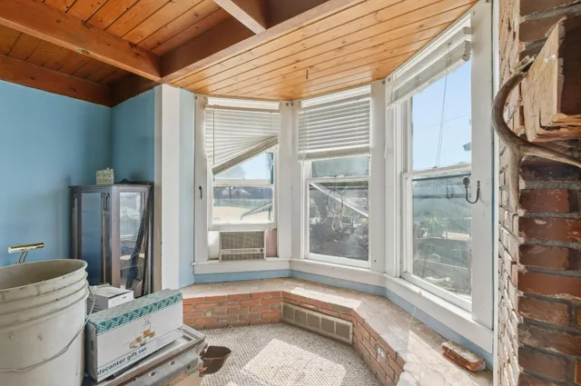 a view of livingroom with furniture and a fireplace