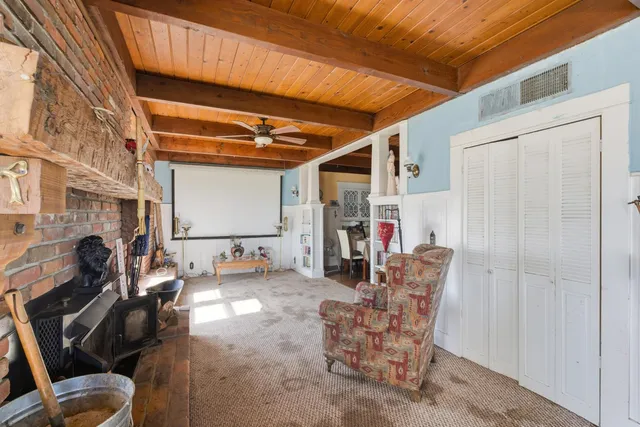 a dining room with furniture and a chandelier