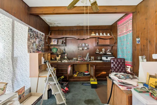 a kitchen with stainless steel appliances granite countertop a sink a stove and a wooden cabinets