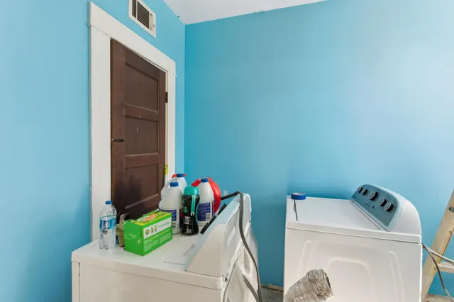 a bathroom with a granite countertop sink a toilet and shower