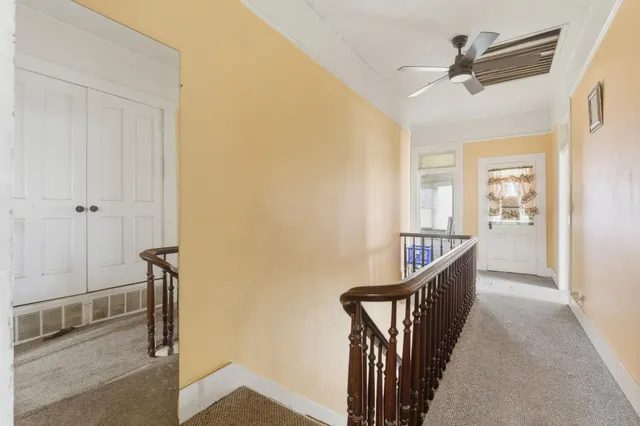 an aerial view of a house with a lake view