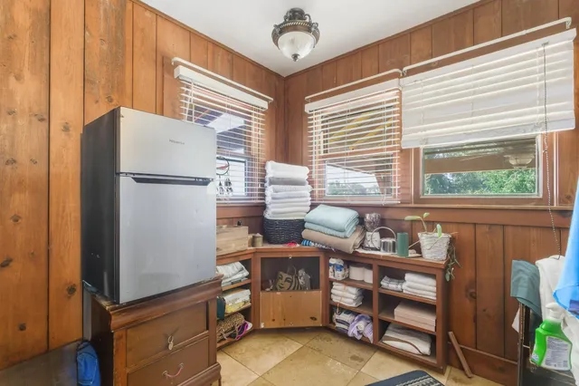 an aerial view of multiple houses with a yard