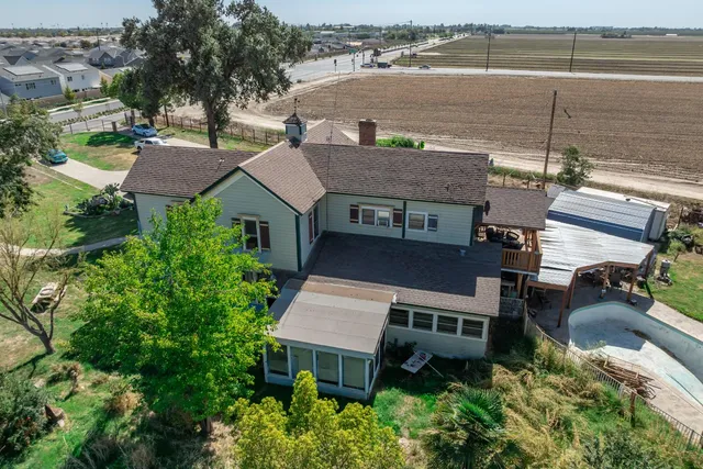 an aerial view of a balcony with seating space