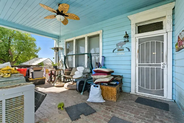 a view of a hallway with wooden floor and entryway