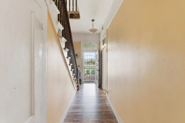 a bathroom with a granite countertop sink a toilet and a mirror